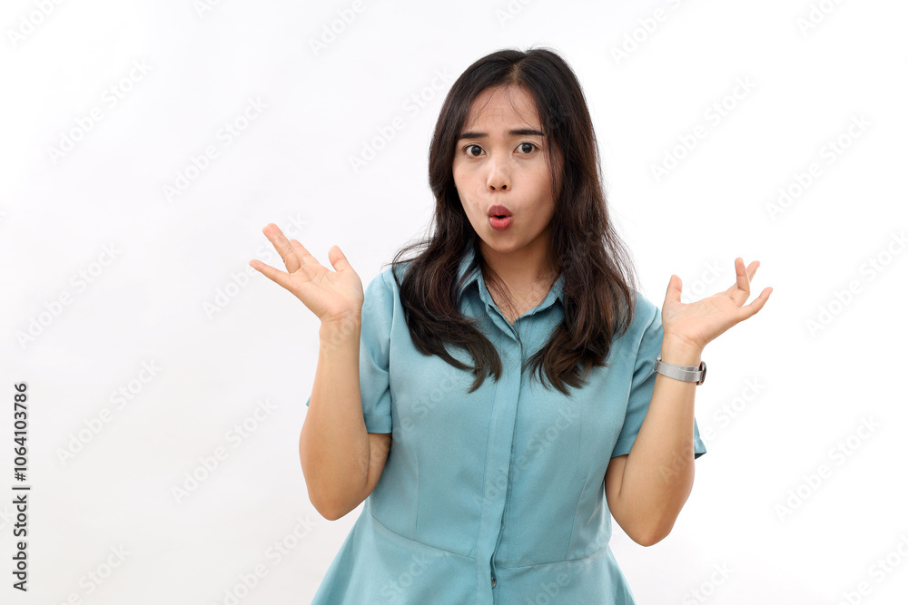 Funny playful woman mimicking fish, raises hands, shows her hilarious side, fools around, wears casual shirt, has childish expression, poses indoor against white background Funny playful woman mimicking fish, raises hands, shows her hilarious side, fools around, wears casual shirt, has childish expression, poses indoor against white background