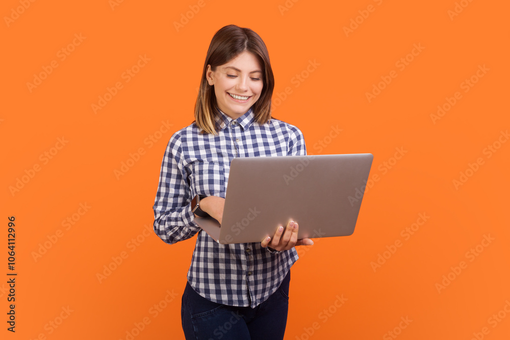 Successful smiling woman typing on laptop keyboard, browsing internet, making presentation Successful smiling woman typing on laptop keyboard, browsing internet, making presentation