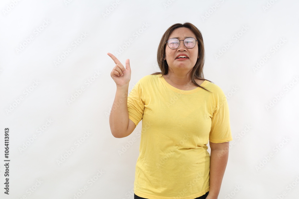 Upset crying young woman, expresses negative emotions indicates away on blank copy space shows something unpleasant, isolated white background Upset crying young woman, expresses negative emotions indicates away on blank copy space shows something unpleasant, isolated white background