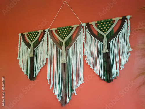 macrame wall hanging with combination colour. wall panel made of cotton threads in natural color using the macrame technique for home decor and wedding decoration