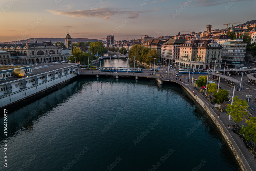 Obraz premium Beautiful aerial view of the city of Zurich in Switzerland - the Limmat River and its iconic churches, buildings rivers and Clockes.