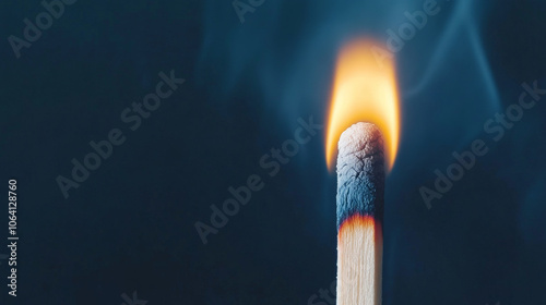 close up of burning matchstick with vibrant flame and smoke against dark background, capturing essence of light in darkness