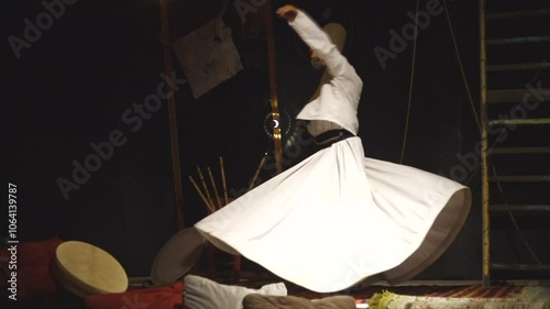 the image of a whirling Dervish in the darkness