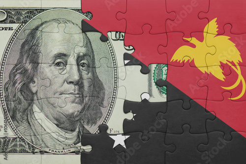 Wallpaper Mural puzzle with the national flag of Papua New Guinea and the usa dollar money .finance concept Torontodigital.ca