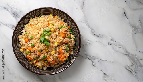 Homemade fried rice, overhead view on a white marble ceramic background 