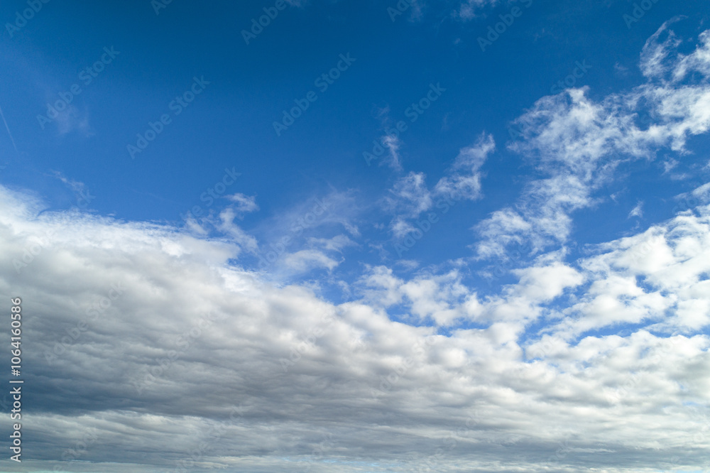 Serene Blue Sky with Layered White Clouds Serene Blue Sky with Layered White Clouds