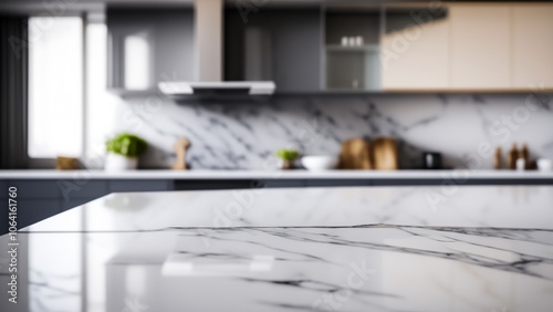 Closeup of a clean marble kitchen countertop with a blurred background of a modern kitchen. photo