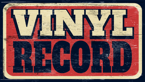 Aged and worn vinyl record sign on wood
