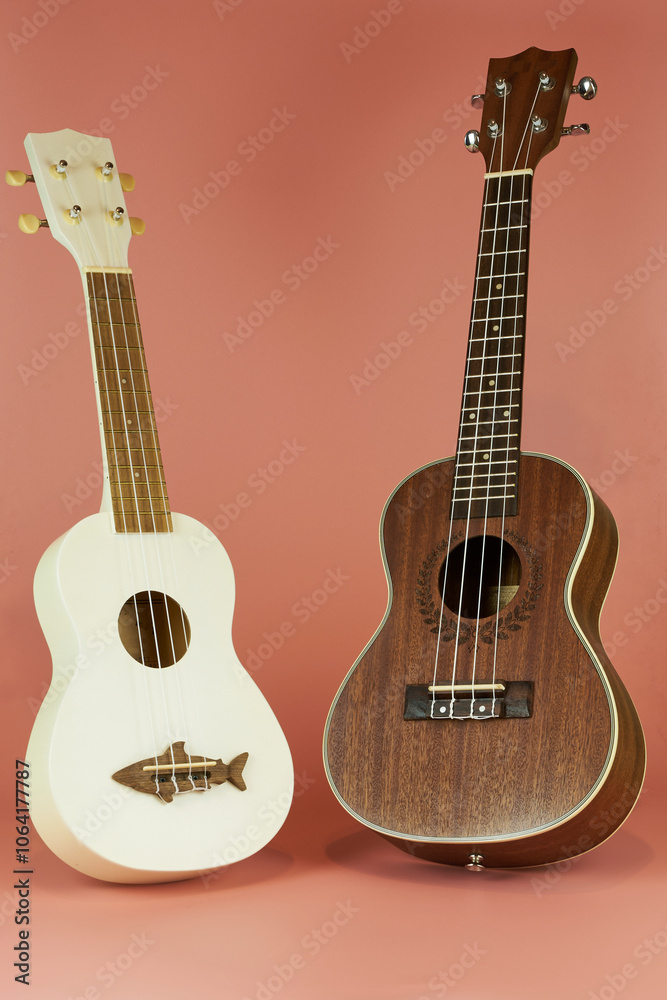 Obraz premium Ukulele. Hawaiian instrument that resembles a guitar but smaller in size with four strings that give it a unique sound.