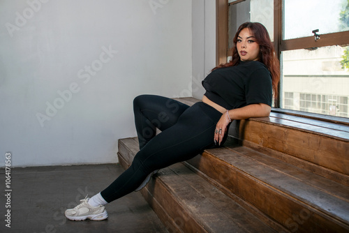 Woman in Workout Gear Leaning on Steps