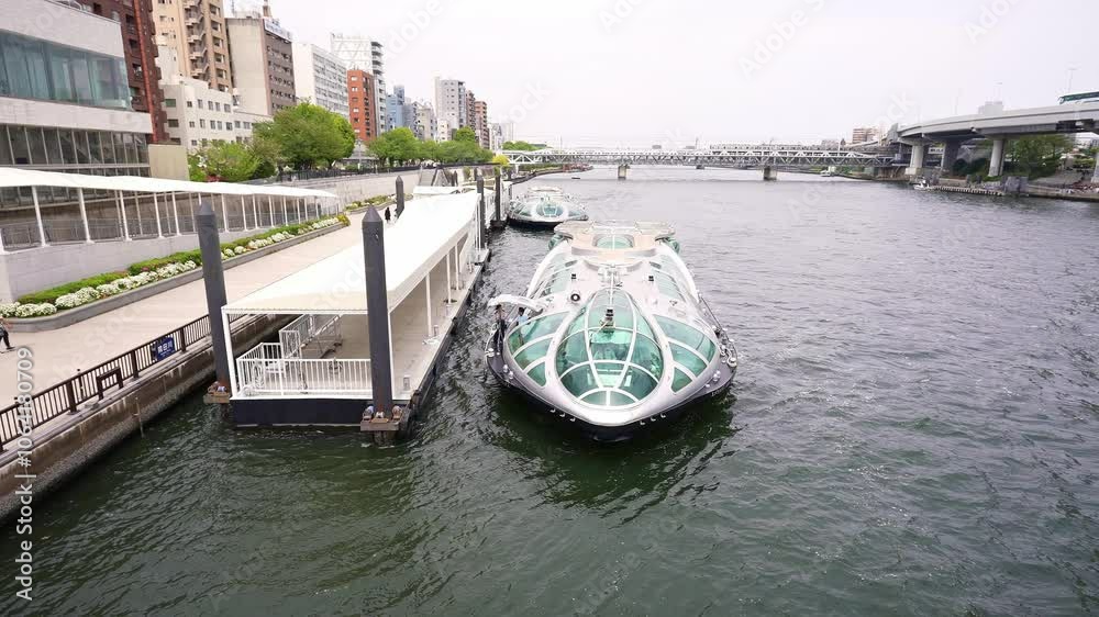 Hotaluna boat in center of Tokyo, futuristic looking cruise boat. Popular tourism destination and iconic Japanese landmark. Hotaluna boat in center of Tokyo, futuristic looking cruise boat. Popular tourism destination and iconic Japanese landmark.