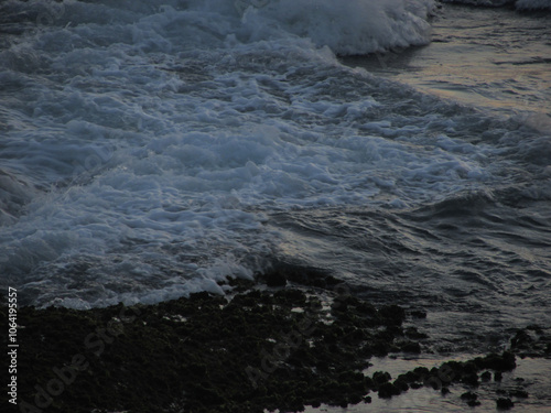 Sea water hitting the rocks of a rock