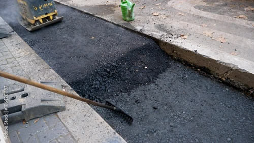 Asphalt filling - road construction site