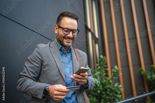 Businessman have online shopping on mobile phone with credit card photo