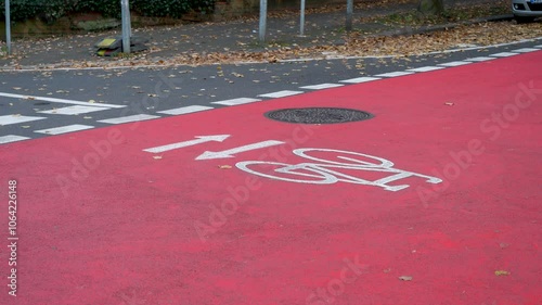 Wiesbaden, Germany - November 04, 2024: A bicycle lane in the city center of Wiesbaden, Germany. Some cyclists and cars passing by
