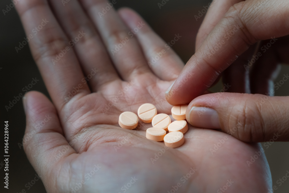 Women hands holding pills of vitamin or supplement. Healthcare and medical concept Women hands holding pills of vitamin or supplement. Healthcare and medical concept