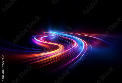 Abstract image of vibrant streaks of light twisting and turning on a black background.