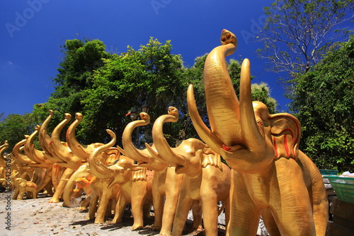 Golden elephant statue on Kho Hong Mountain for worship Thao Maha prom (Shrine of Lord Brahma the Great) in Hat Yai, Songkhla Province, Thailand  photo