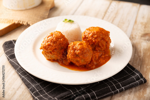 Meatballs in red chipotle chili and tomato sauce, ground pork or beef stuffed with cheese. A very popular homemade food recipe in Mexico and other countries, commonly served with rice.