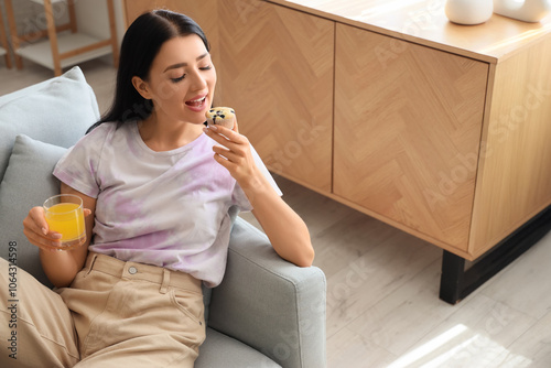 Young woman with glass of j...