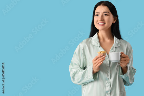 Young woman in pajamas with...