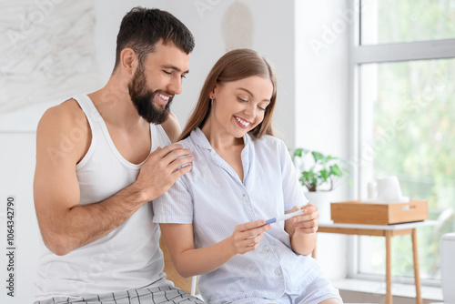 Happy young couple with pre...