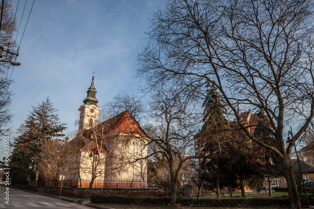 Fototapeta premium The Rimokatolicka Crkva Svete Terezije Avilske church in Kovin, Serbia, stands as a historic Catholic landmark showcasing intricate architecture and religious heritage.