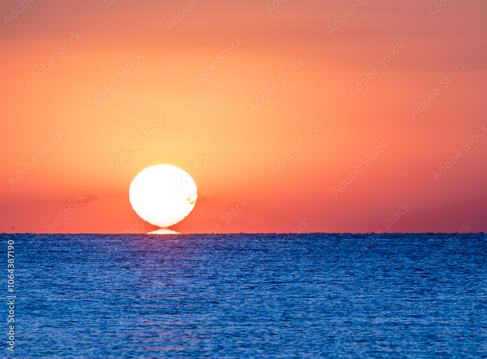 The moment the sun breaks off over the sea. The moment the sun breaks off over the sea.