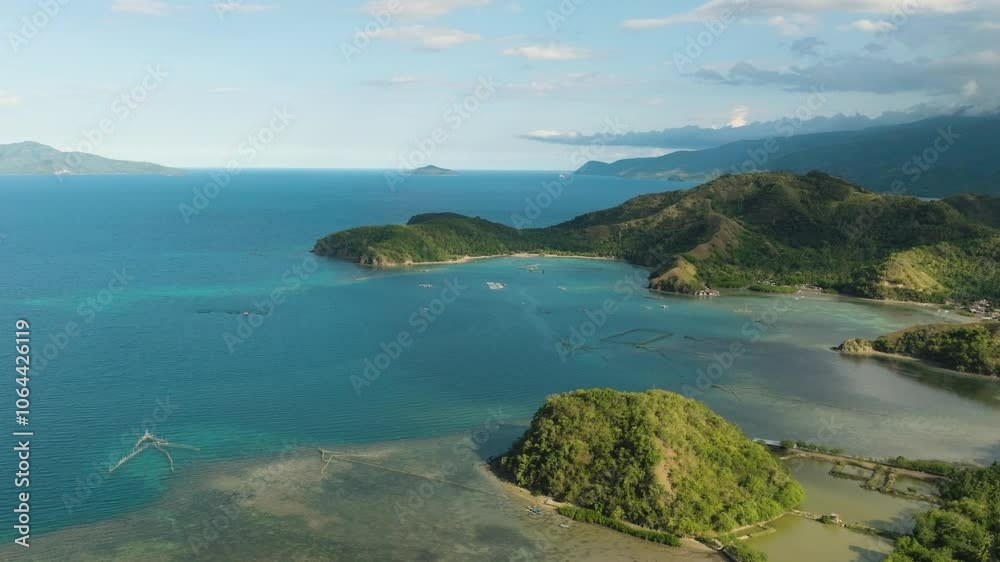 Tropical island in formation of sleeping dinosaur. Beautiful water and corals. Mati, Davao Oriental. Philippines. Tropical island in formation of sleeping dinosaur. Beautiful water and corals. Mati, Davao Oriental. Philippines.