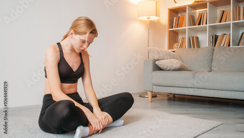 Smart rest. Meditation action. Relaxed slim pretty woman in black sportswear practicing yoga closing eyes with head down on white background.