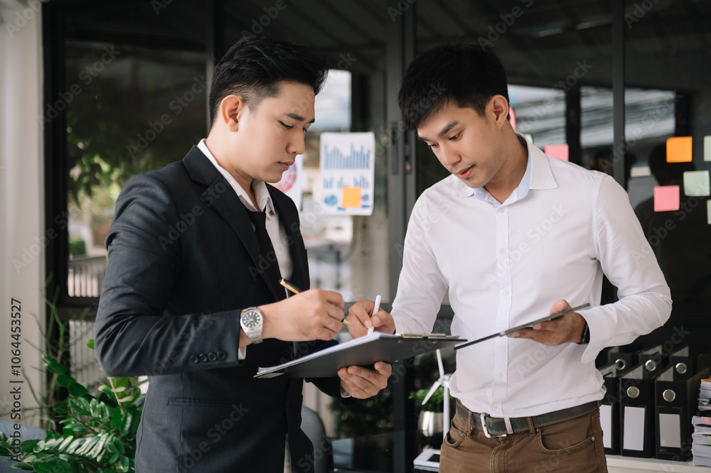 Portrait of success business people working together in home office. Couple teamwork startup concept. Portrait of success business people working together in home office. Couple teamwork startup concept.