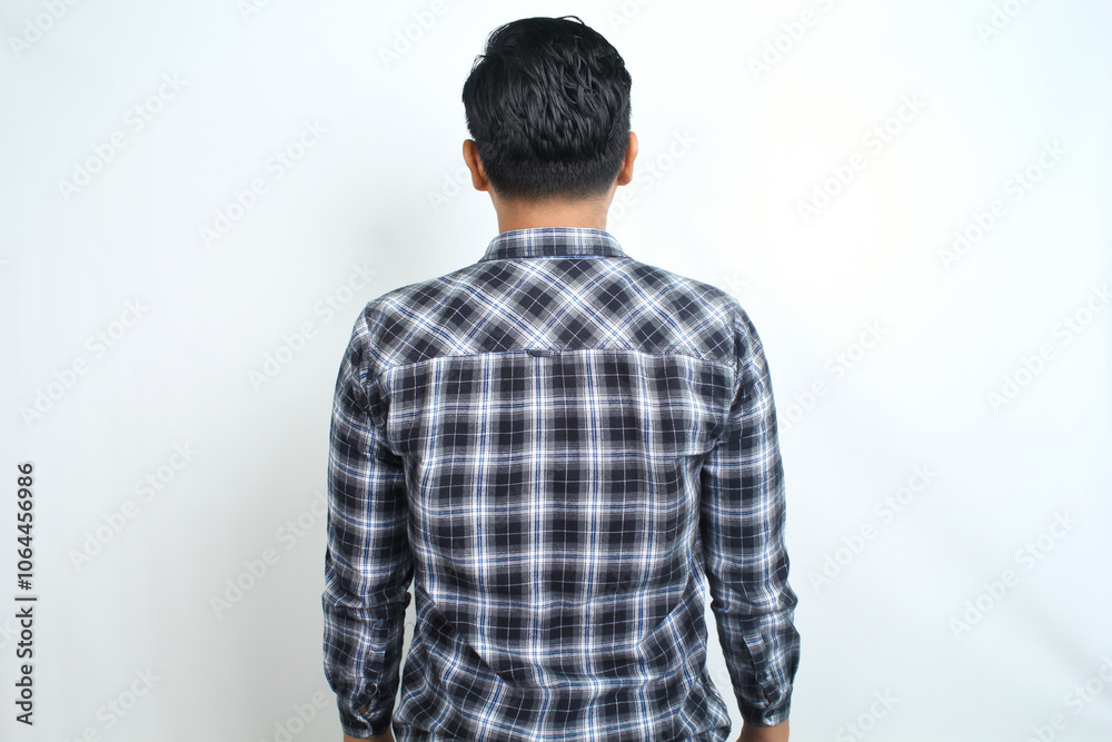 back view of groomed black short hair man wearing blue plaid shirt isolated on white background