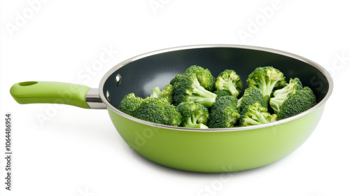 Fresh broccoli in green frying pan, ready for cooking. This vibrant image showcases healthy vegetables, perfect for nutritious meal