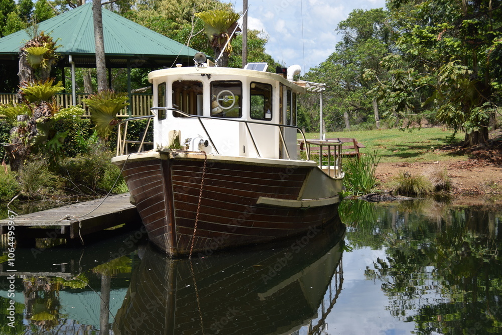 Scenic pond image with boat in the pond Scenic pond image with boat in the pond