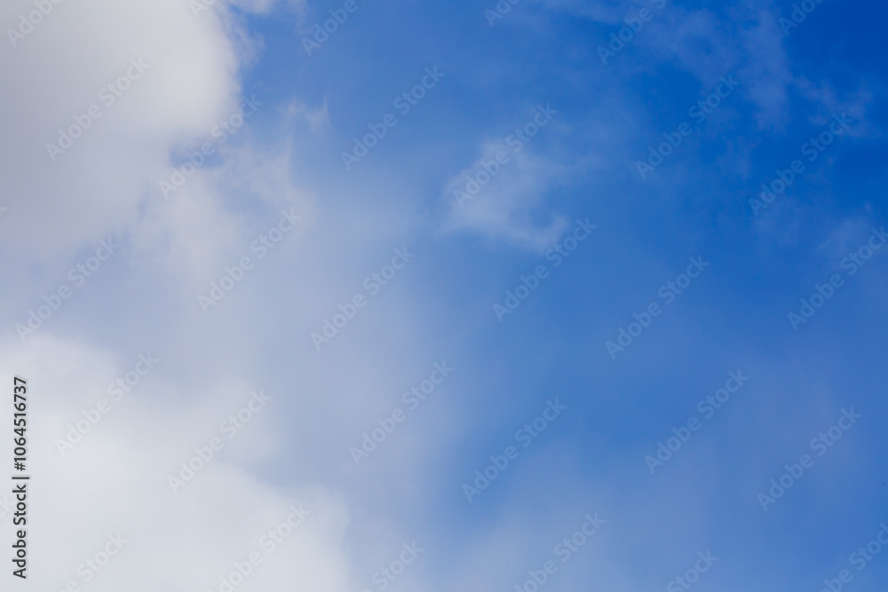 White heap clouds in the blue peaceful sky. The concept of psychological calmness and health. Peace of mind with the forces of nature. Air travel concept.