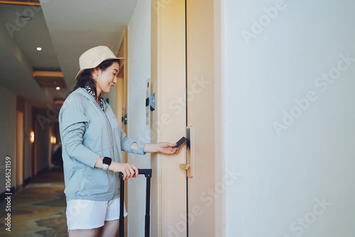 Young Traveler Accessing Hotel Room with Key Card