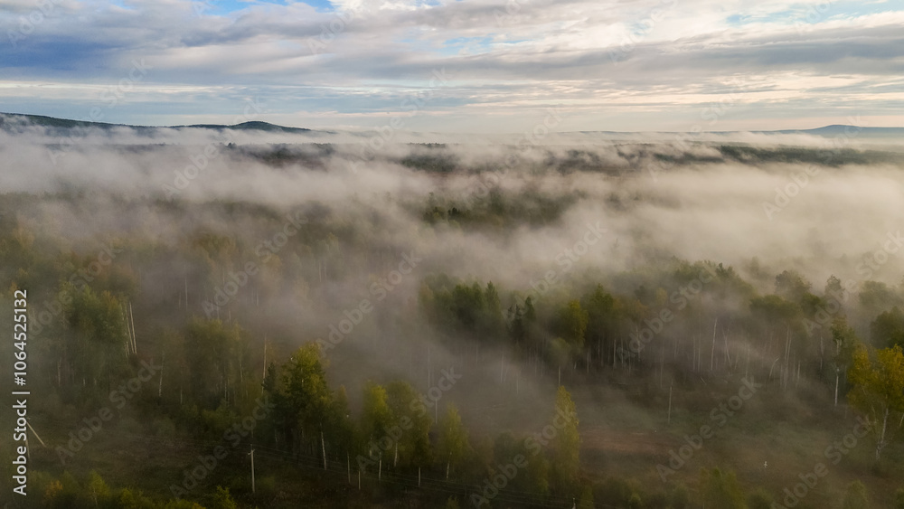 fog over the forest at dawn in autumn from the height of a drone fog over the forest at dawn in autumn from the height of a drone