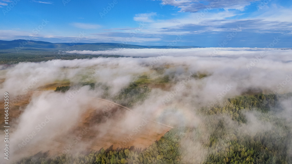 Flying above the clouds at dawn in autumn Flying above the clouds at dawn in autumn