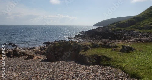 wide shot looking east along the rocky coastline of the mull of Galloway at east Tarbet beach photo