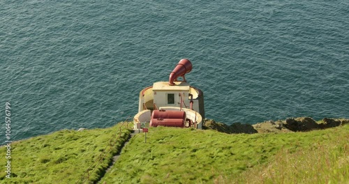 wide shot of the Mull of Galloway foghorn
