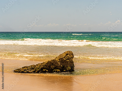 Fototapeta Naklejka Na Ścianę i Meble -  Isolated Triangular Beach Rock Detail