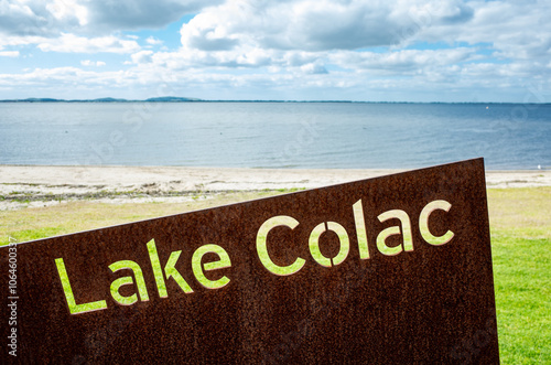 Lake Colac Sign with Scenic Australian Lake View Background. Regional Australia Waterfront Landscape. The landmark is the largest freshwater lake in Victoria. photo