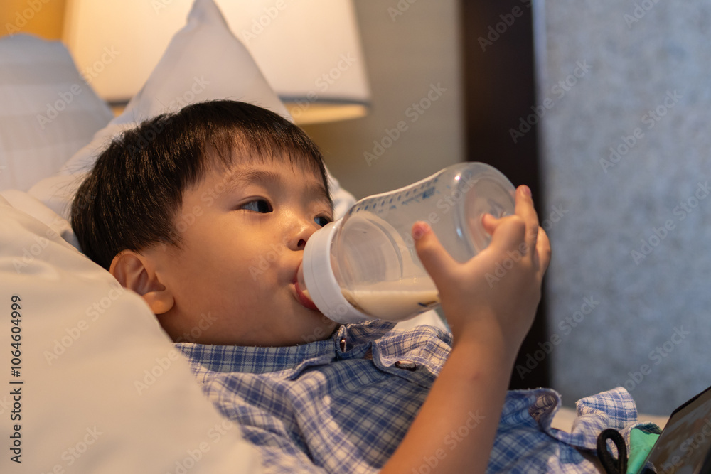 custom made wallpaper toronto digitalAsian Chinese baby boy age 3 to 4 drinking milk with holding milk bottle by him self.