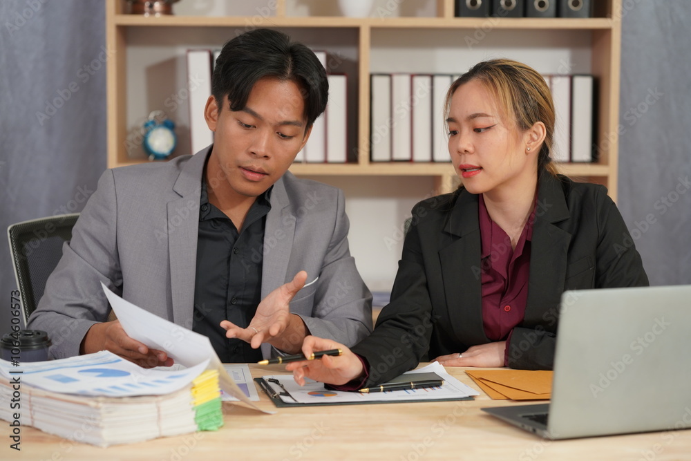 Financial Analysis: Business team working in office with tablets and documents to plan and analyze financial reports discussing investments according to business plan. Financial Analysis: Business team working in office with tablets and documents to plan and analyze financial reports discussing investments according to business plan.