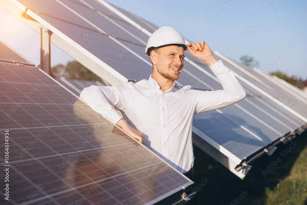 Engineer Inspecting Solar Panels in Renewable Energy Farm Engineer Inspecting Solar Panels in Renewable Energy Farm