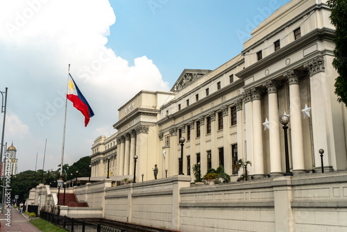 The exterior of the National Museum of Philippine Fine Arts in Manila, Philippines, with the Philippine flag.