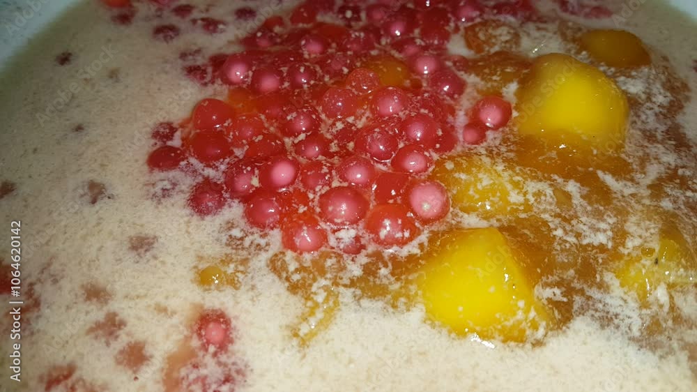 Bubur Ubi is a dessert from Indonesia made of sweet potato, palm sugar and tapioca flour served with coconut milk. Bubur Ubi is a dessert from Indonesia made of sweet potato, palm sugar and tapioca flour served with coconut milk.