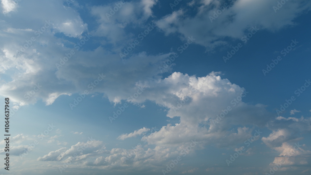 Obraz premium White stratocumulus and cumulus cloudscape on beautiful sunny clear sky. Tropical summer sunlight. Timelapse.