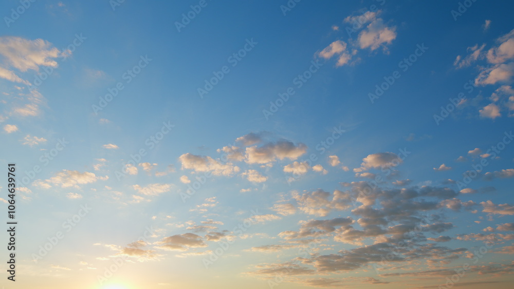 Fototapeta premium Beautiful blue sky with orange and peach clouds background. Natural sunset white and yellow clouds floating on blue sky. Time lapse.
