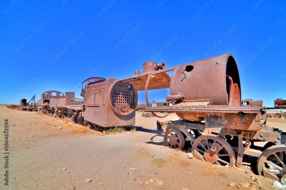 Obraz premium The train cemetery on Salar de Uyuni or salt desert of Uyuni, Bolivia, South America